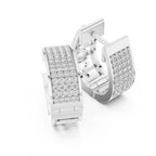 Pair of white gold hoop earrings with clear real diamonds on a white background
