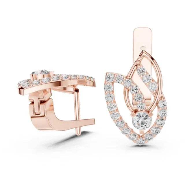 Rose gold earrings with real diamond accents on a white background