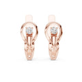 Rose gold earrings with real diamond accents on a white background