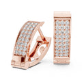 Rose gold earrings with diamond accents on a white background