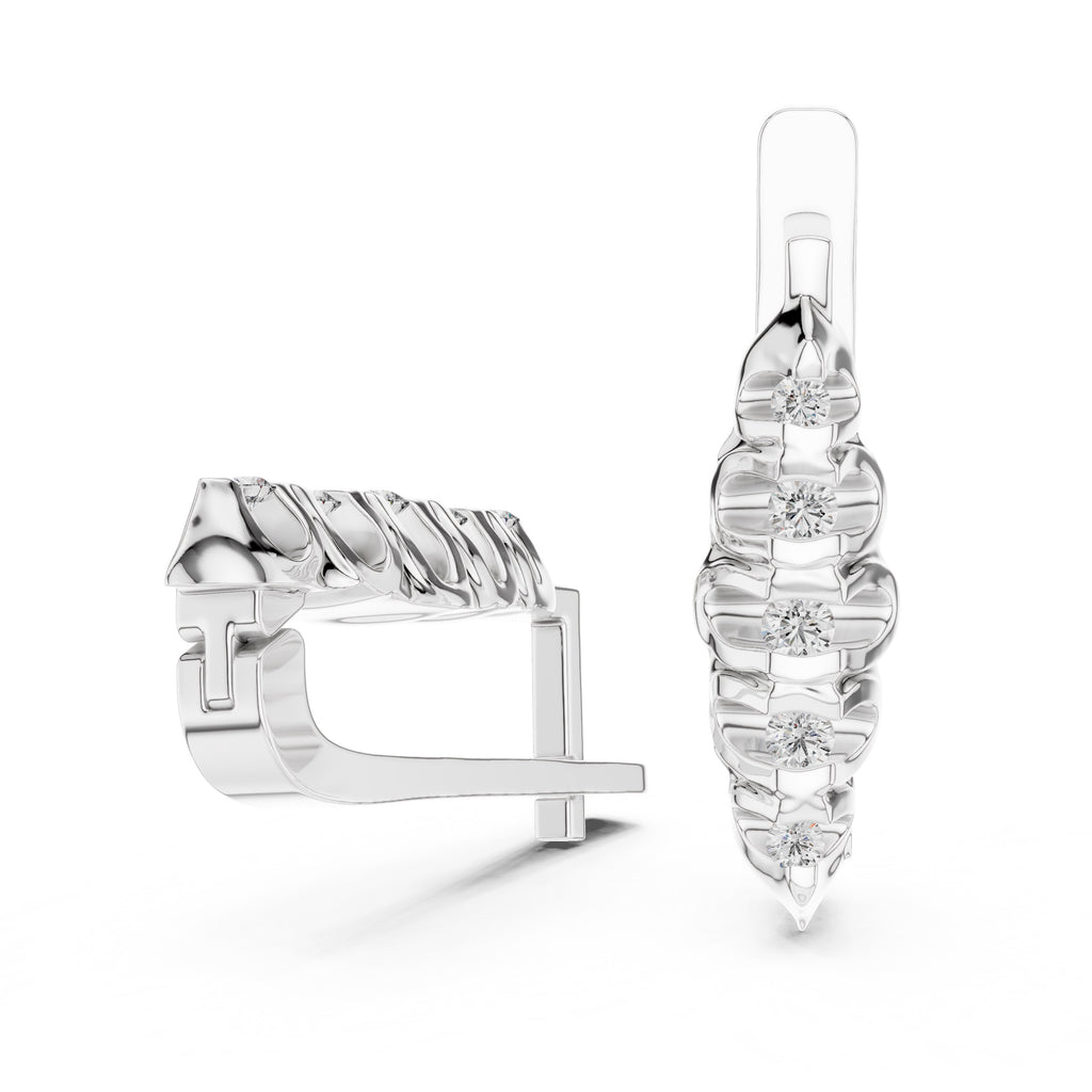 White gold earrings with diamonds  on a white background