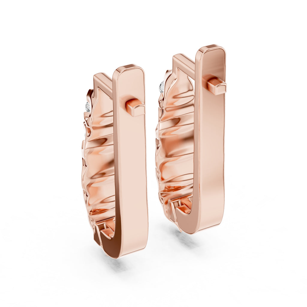 Rose gold hoop earrings on a white background