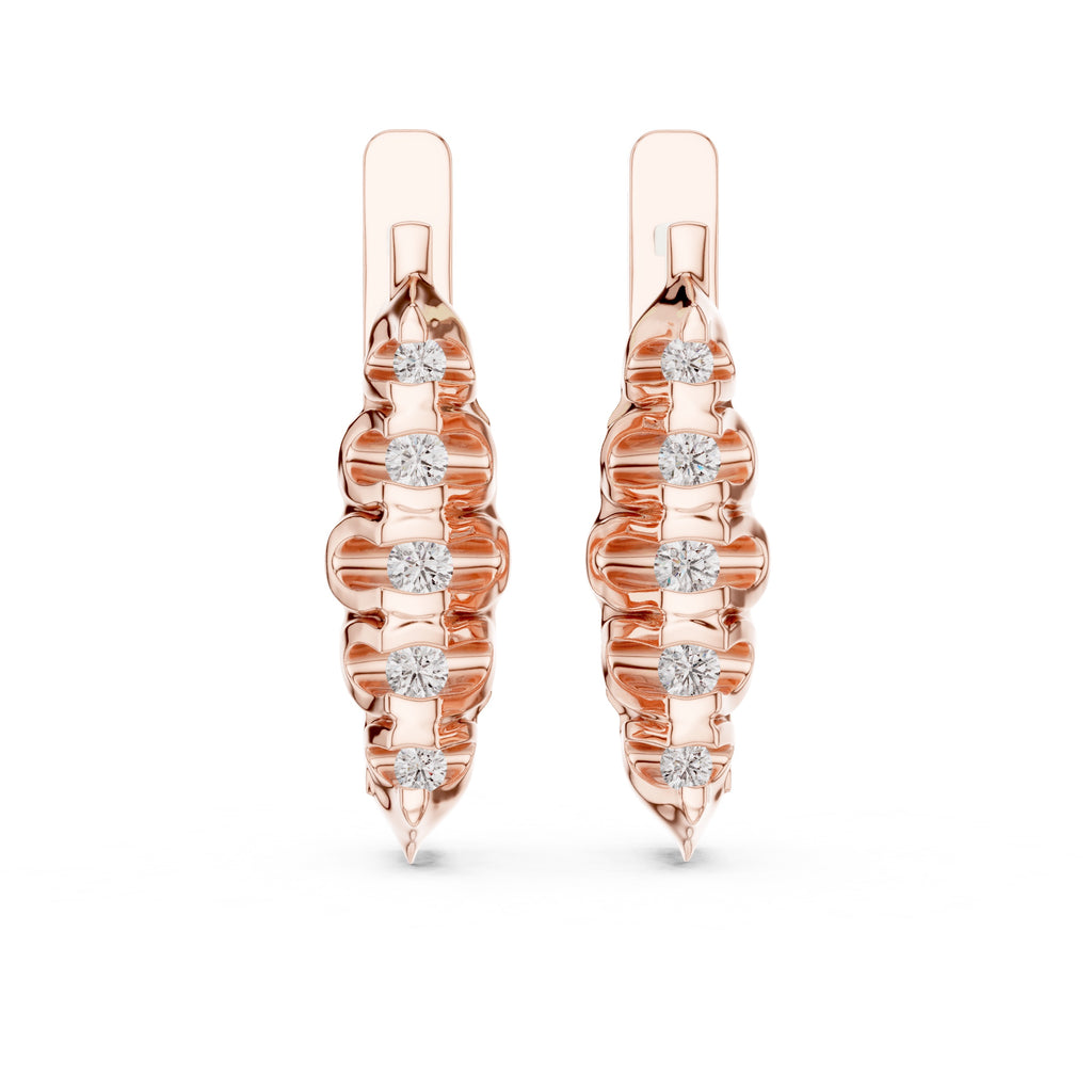 Rose gold earrings with diamond accents on a white background
