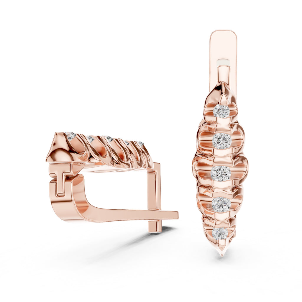 Rose gold hoop earrings with diamond accents on a white background