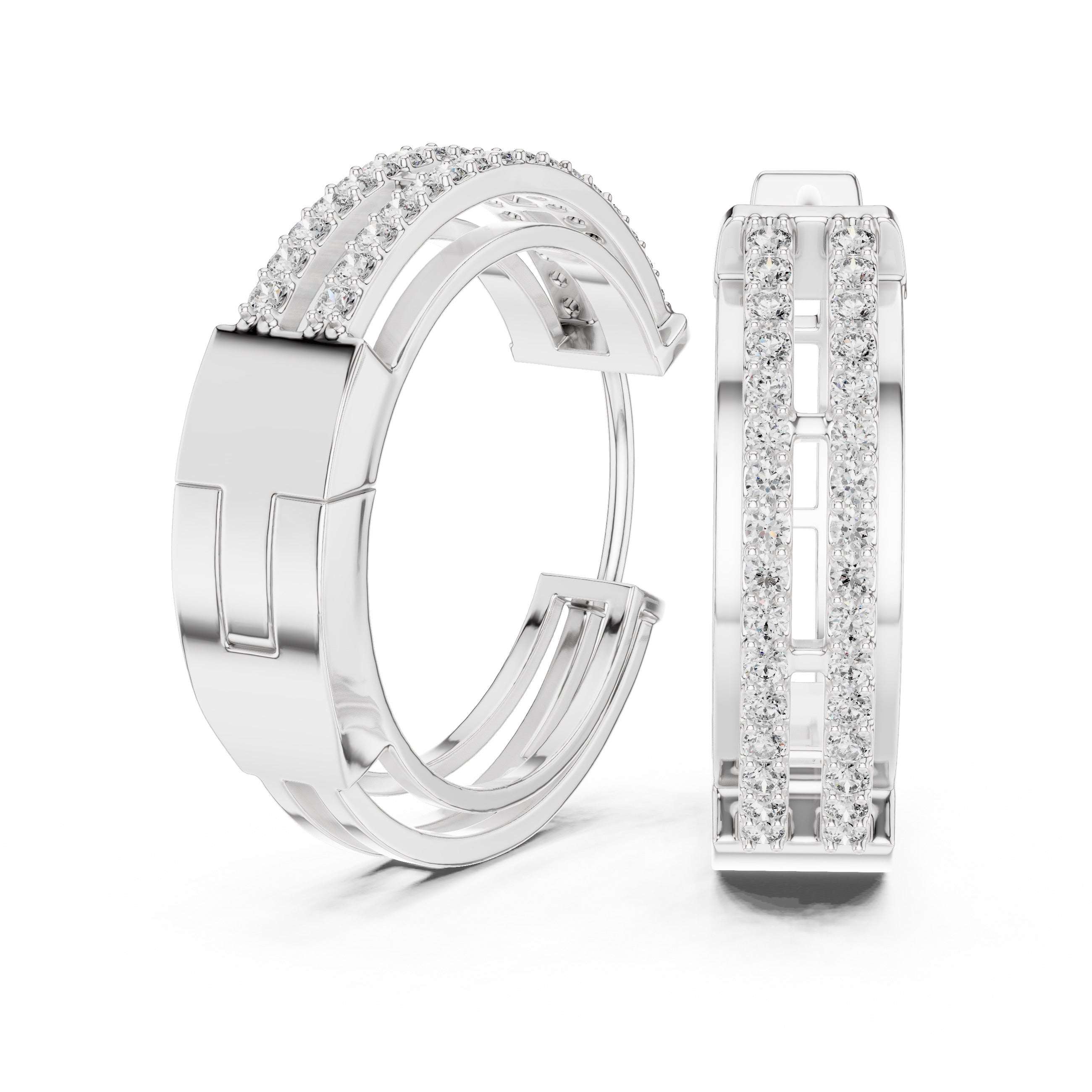 Pair of white gold hoop earrings with clear gemstones on a white background