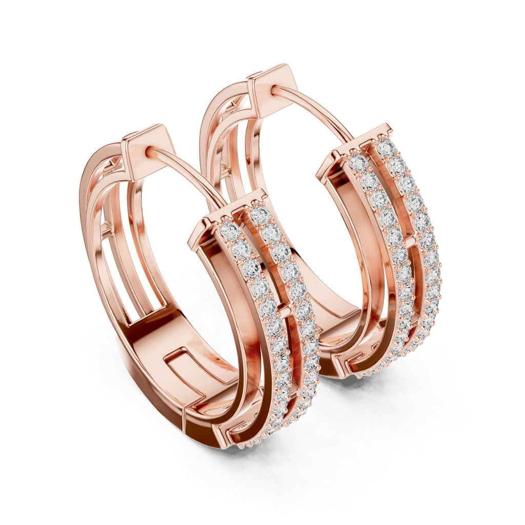 Rose gold hoop earrings with diamond accents on a white background