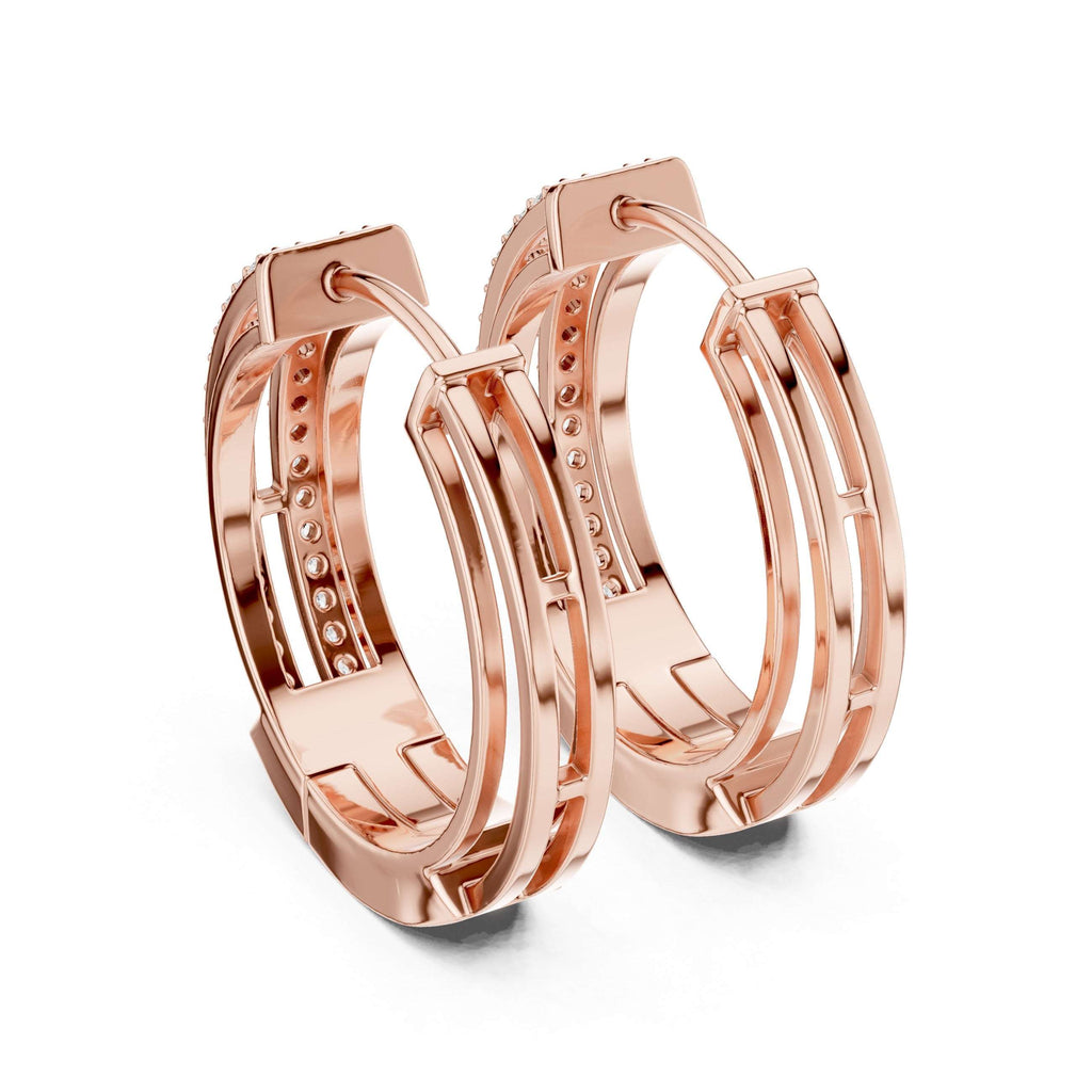 Rose gold hoop earrings with diamonds on a white background