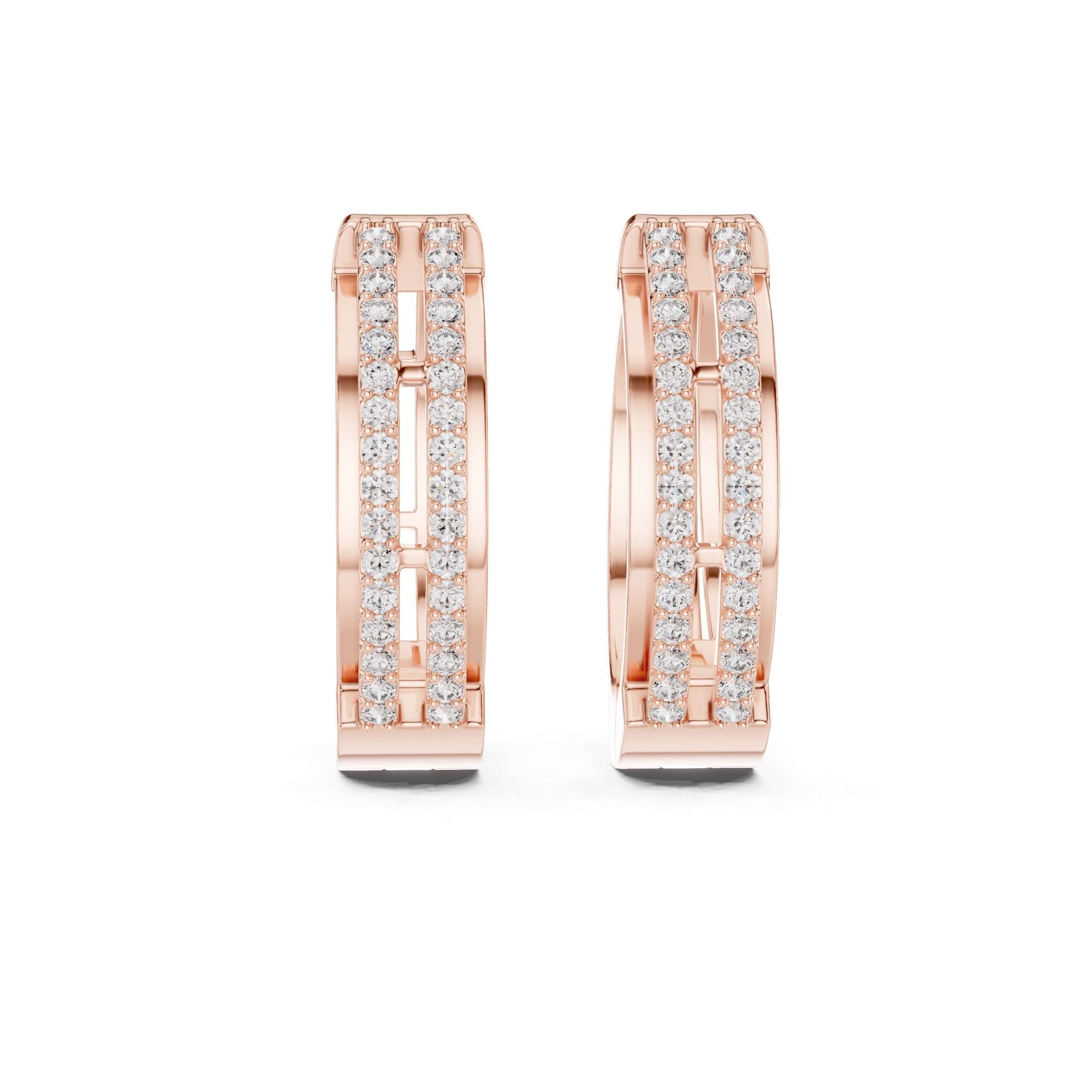 Gold hoop earrings with embedded diamonds on a white background