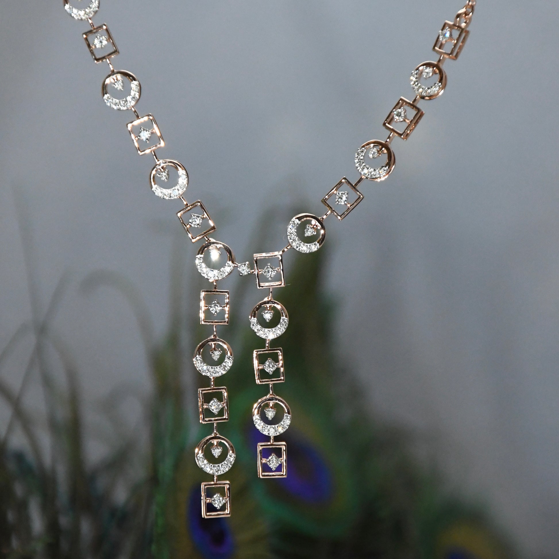 Delicate diamond necklace on a blurred natural background