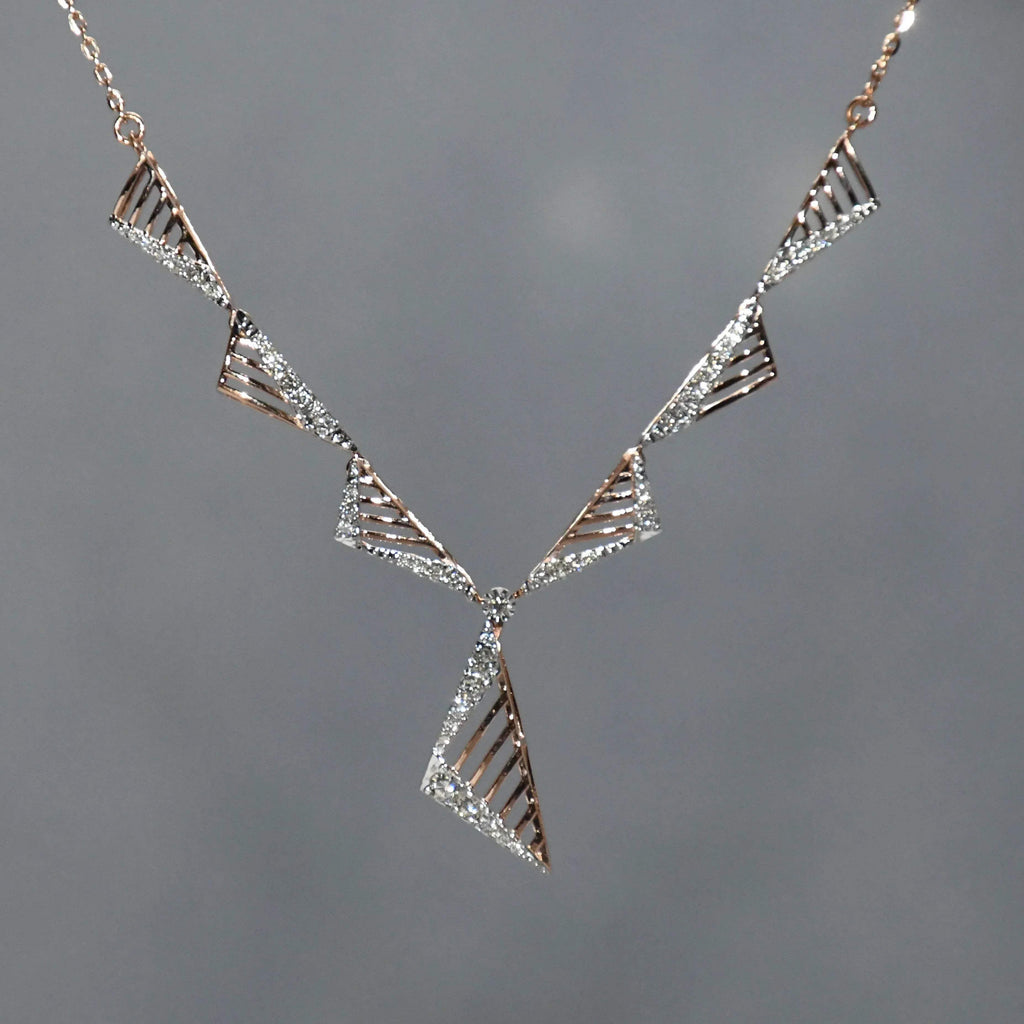 diamond necklace with geometric design on a gray background