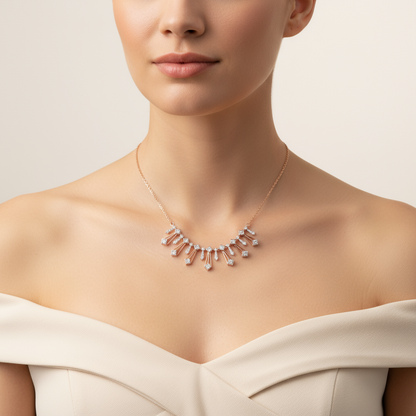 Necklace with small diamonds on a model wearing a white dress against a beige background.
