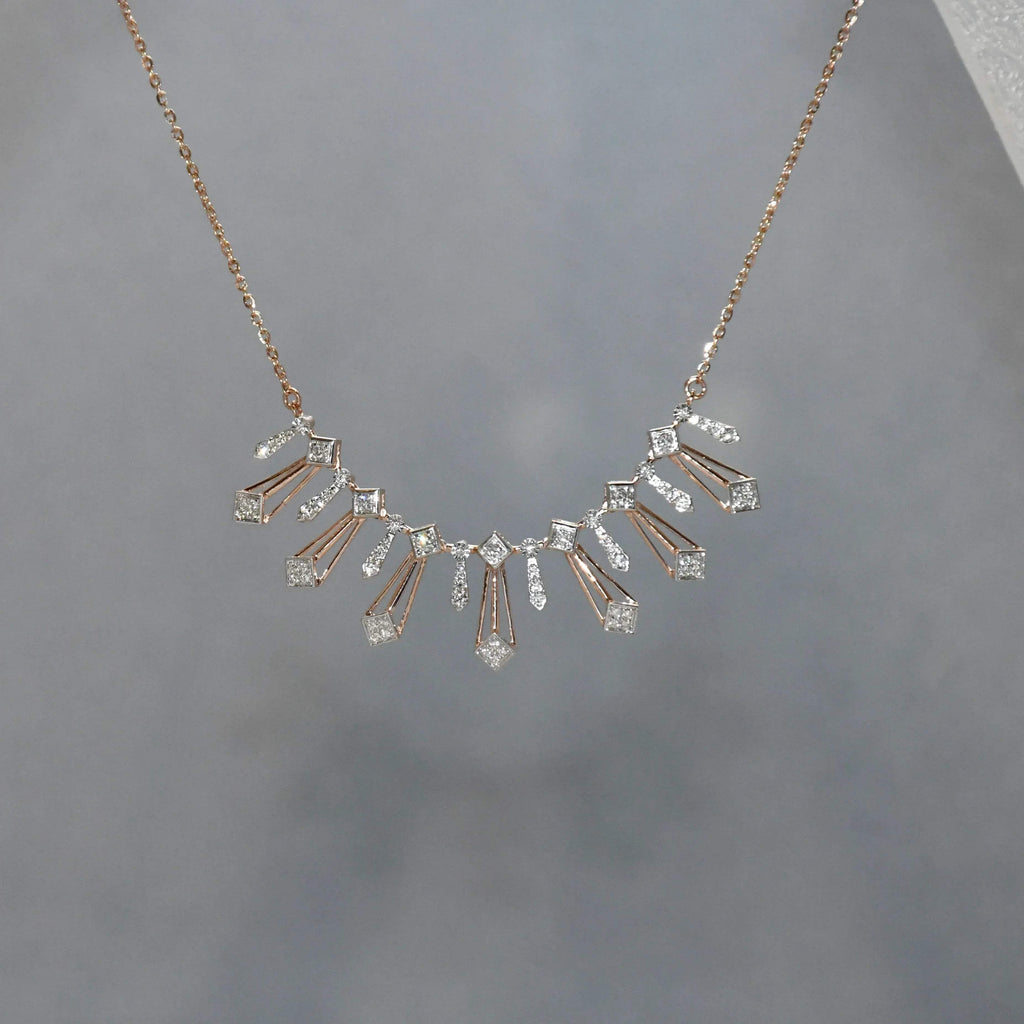 Delicate necklace with diamonds on a gray background