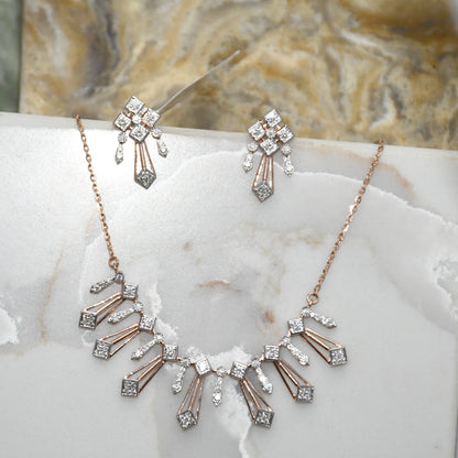 Diamond necklace and matching earrings on a marble surface
