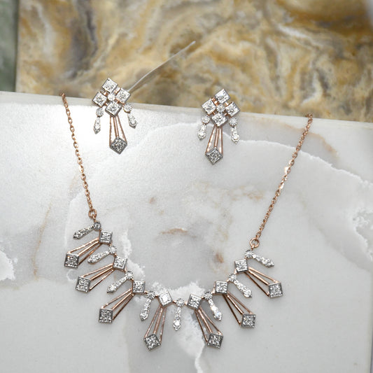 Diamond necklace and matching earrings on a marble surface