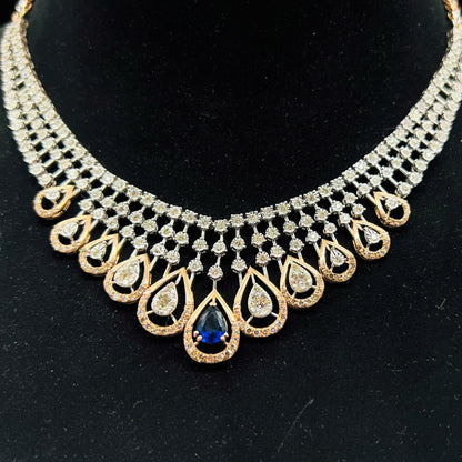 A gold bridal diamond necklace with round-cut beauty displayed on a mannequin bust.