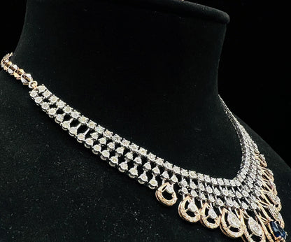 A gold bridal diamond necklace with round-cut beauty displayed on a mannequin bust.