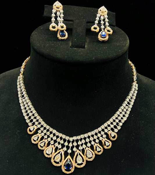 A gold bridal diamond necklace with round-cut beauty displayed on a mannequin bust.