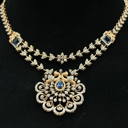A gold diamond necklace with a floral pendant, displayed on a mannequin bust.