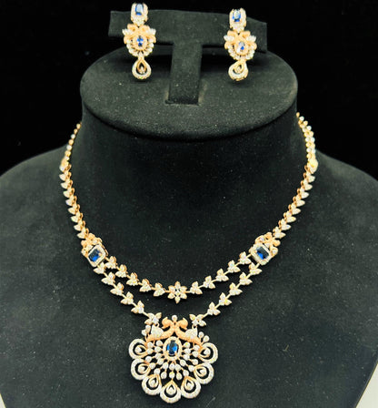 A gold diamond necklace with a floral pendant, displayed on a mannequin bust.