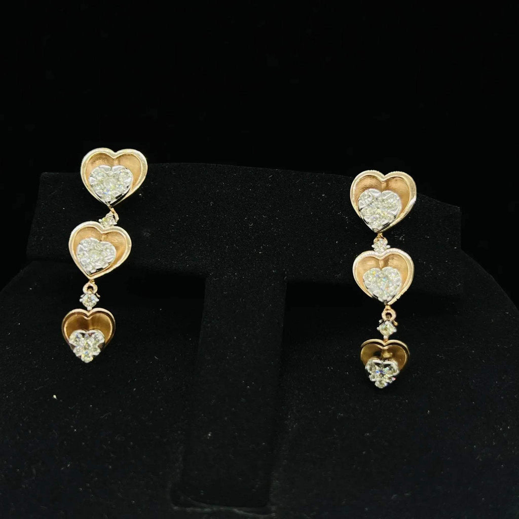 A gold earrings with round-cut diamonds and coordinating earrings, displayed on a black mannequin bust.