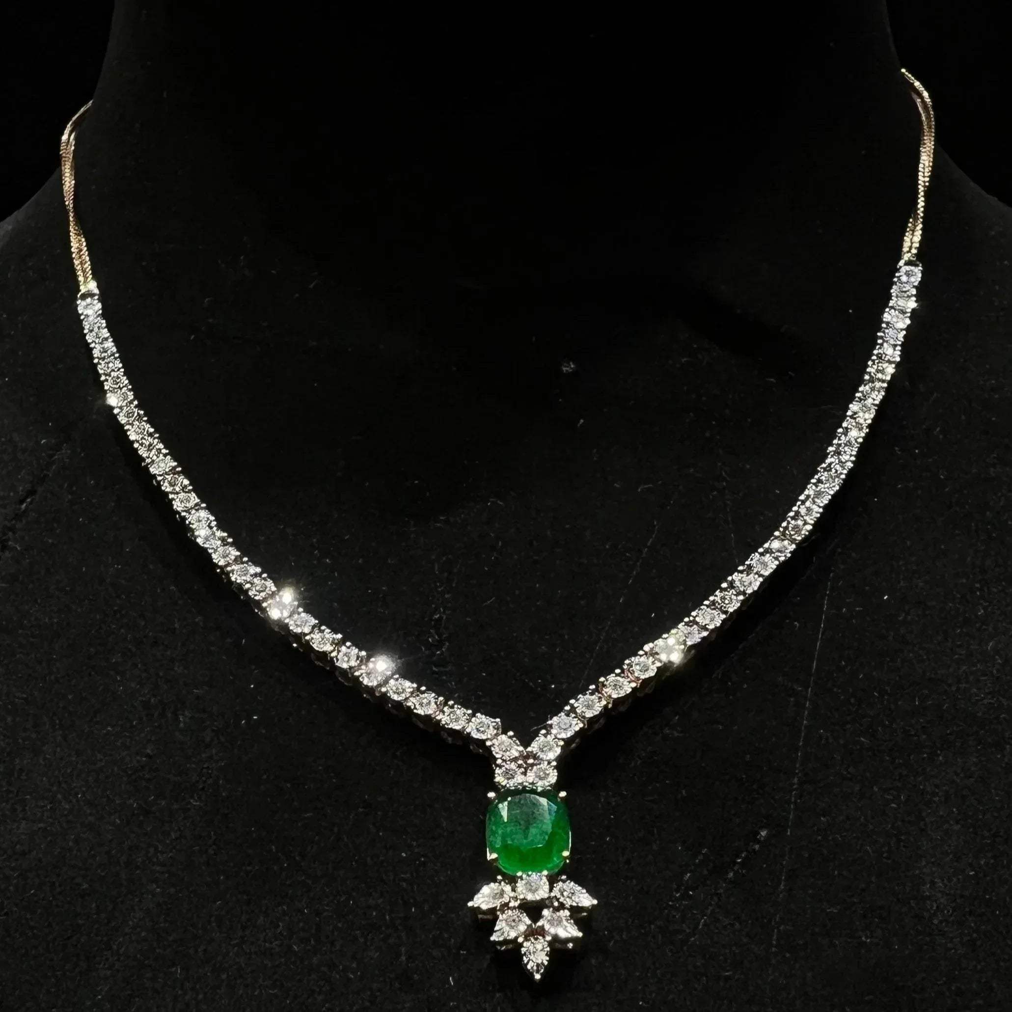 Designer diamond necklace set for women with color stone pendant.