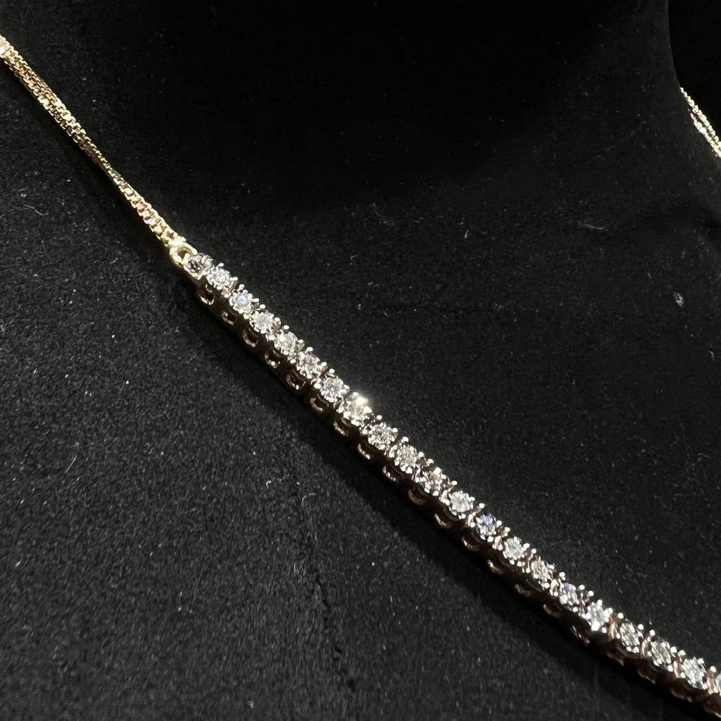 Designer diamond necklace set from side angle is displayed on a mannequin bust.