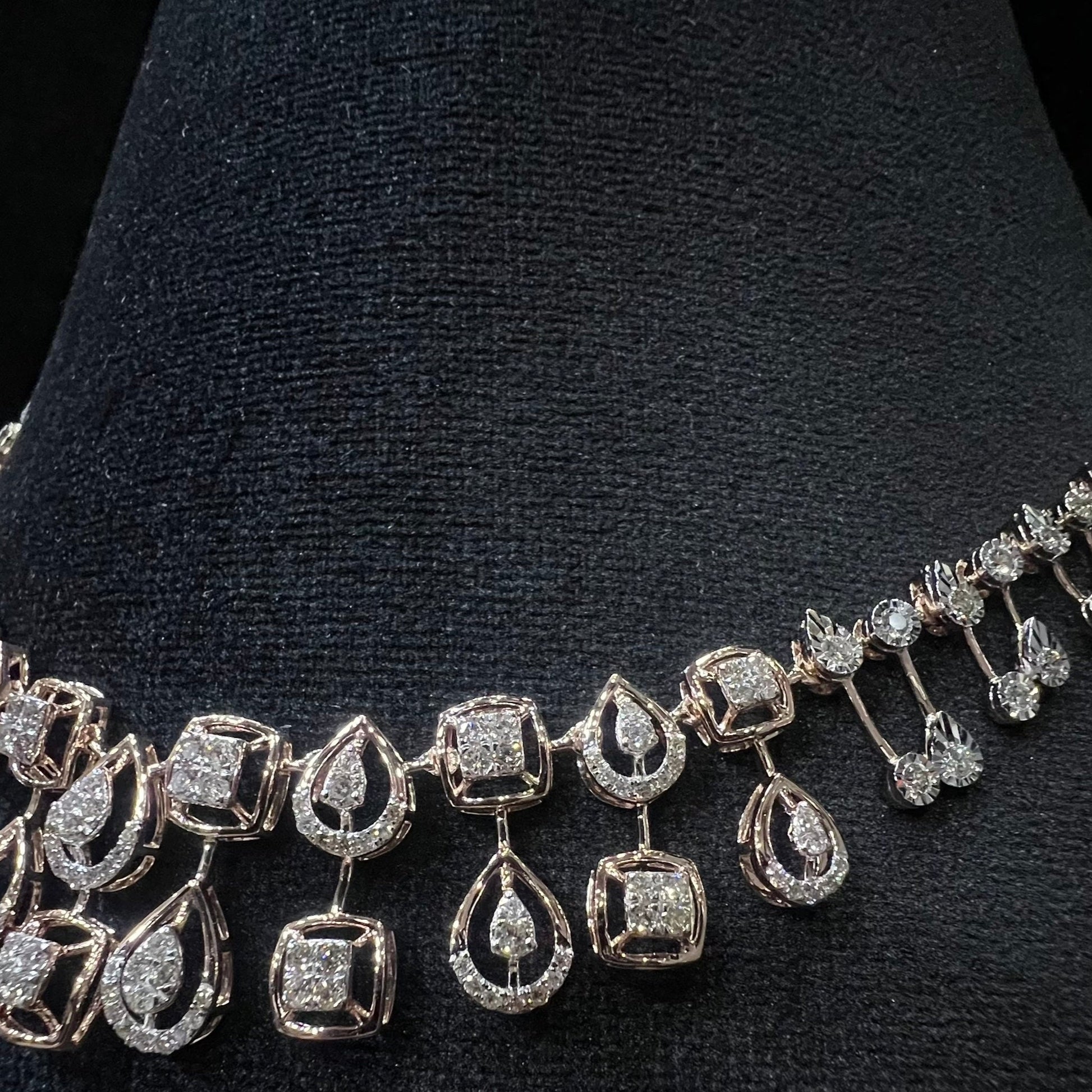 Diamanté necklace on a black stand