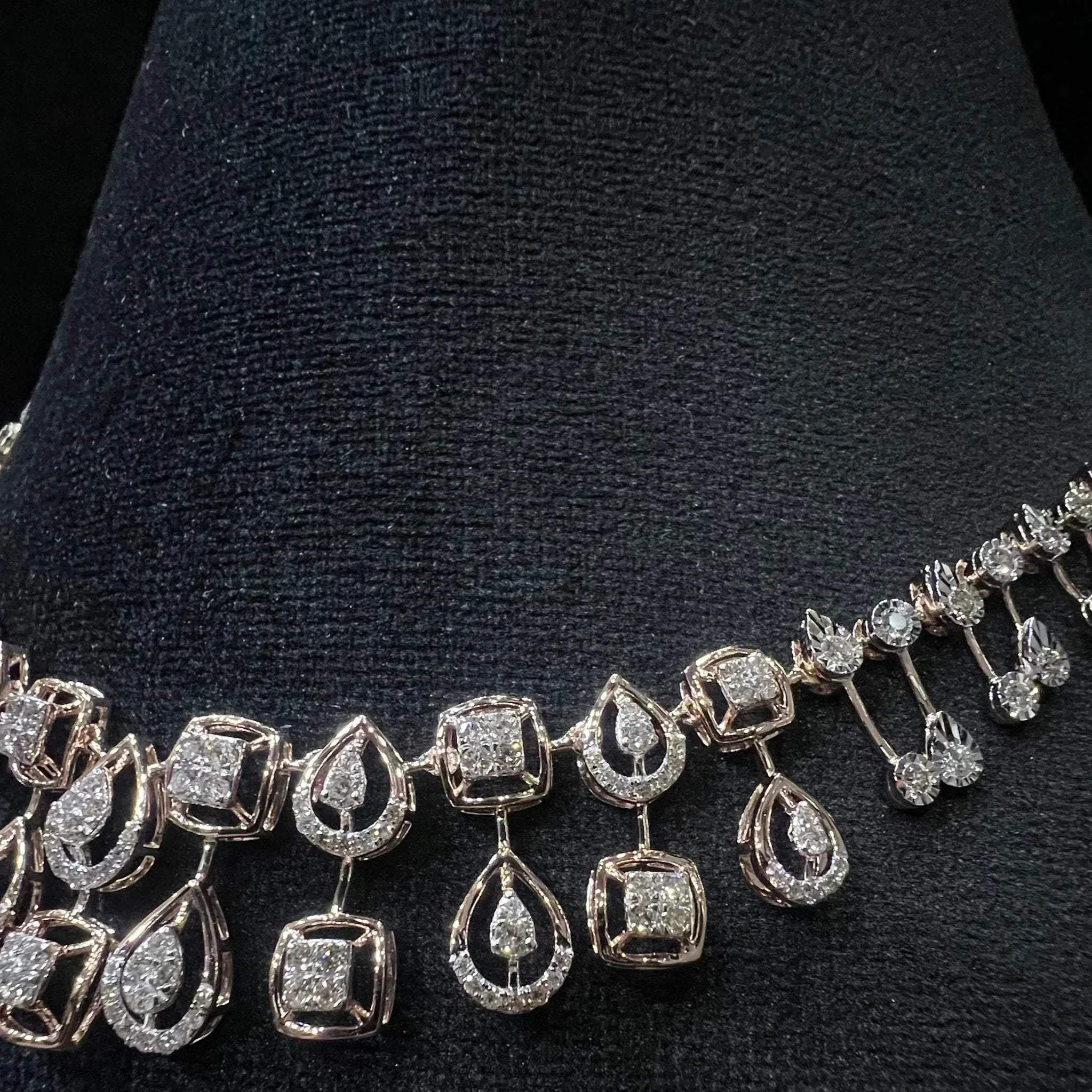 Diamanté necklace on a black stand