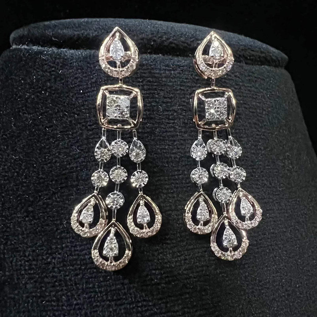 gold diamond earrings set displayed on a mannequin bust, featuring a solid gold structure with diamond encrusted in the earrings.