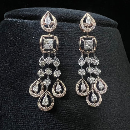 gold diamond earrings set displayed on a mannequin bust, featuring a solid gold structure with diamond encrusted in the earrings.