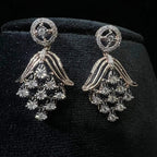 Radiant cascade diamond earrings displayed on black velvet bust