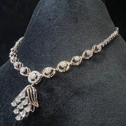 Radiant cascade diamond necklace set displayed on black velvet bust