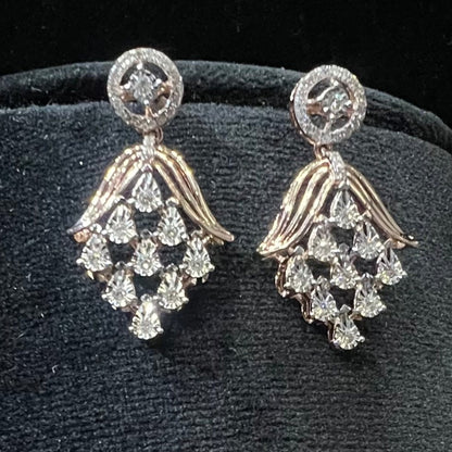 Radiant cascade diamond earrings displayed on black velvet bust