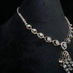 Radiant cascade diamond necklace set displayed on black velvet bust