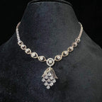 Radiant cascade diamond necklace set displayed on black velvet bust