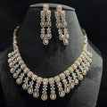 Luxury floral motif diamond necklace set with matching drop earrings on a mannequin bust.