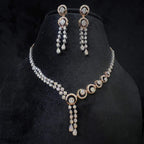 Diamond necklace set with circular motif design and matching drop earrings, featuring sparkling stones in elegant modern style.