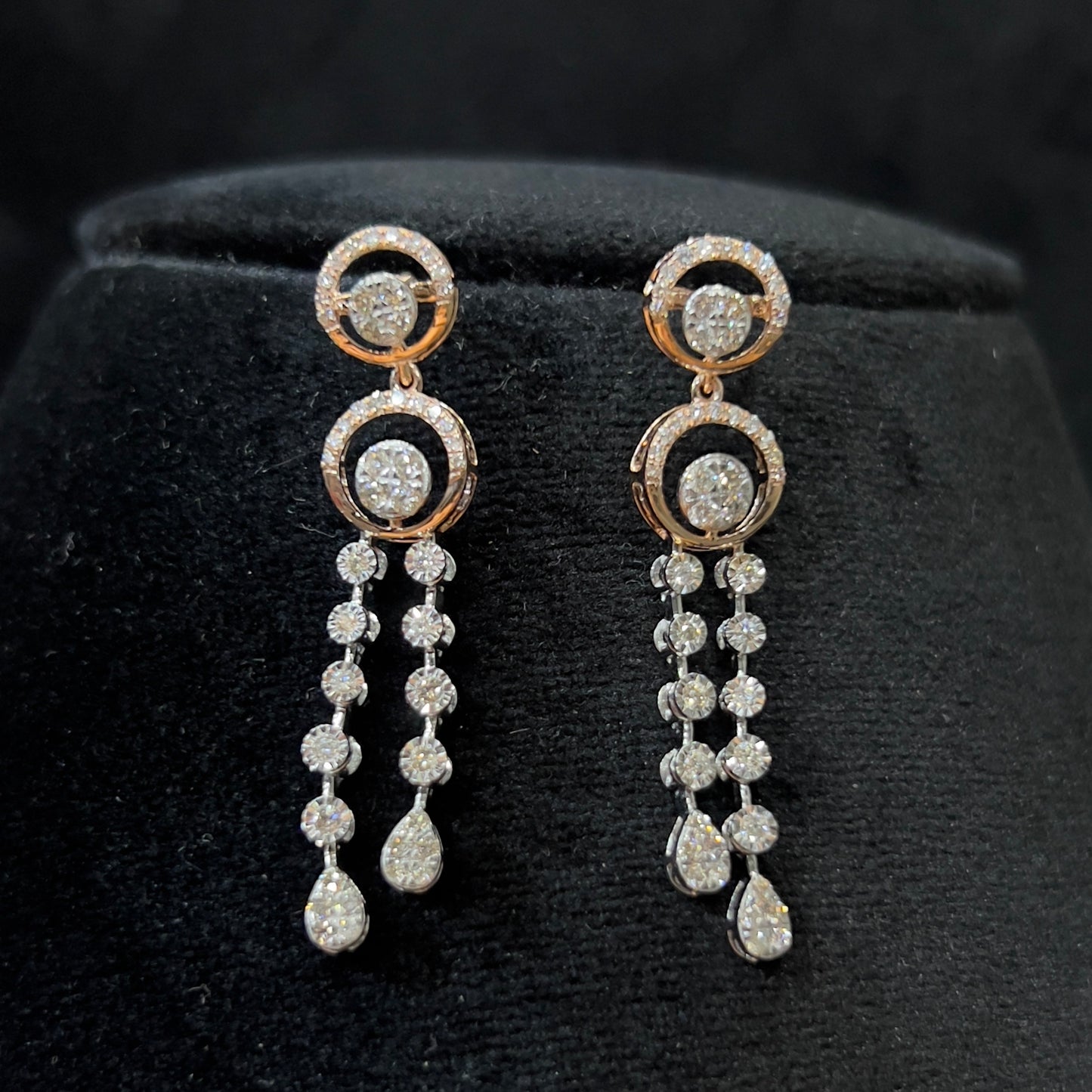 Diamond necklace set with circular motif design and matching drop earrings, featuring sparkling stones in elegant modern style.