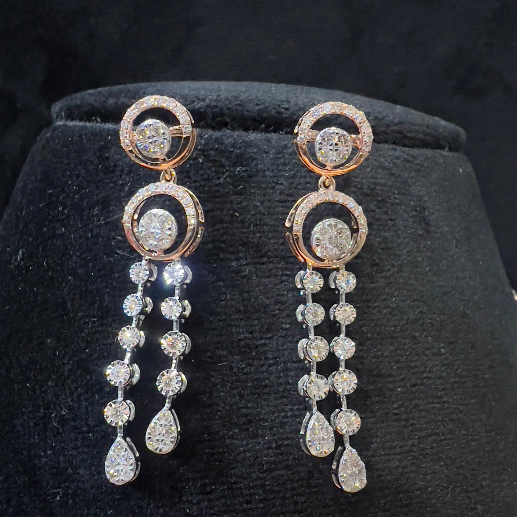 Diamond necklace set with circular motif design and matching drop earrings, featuring sparkling stones in elegant modern style.