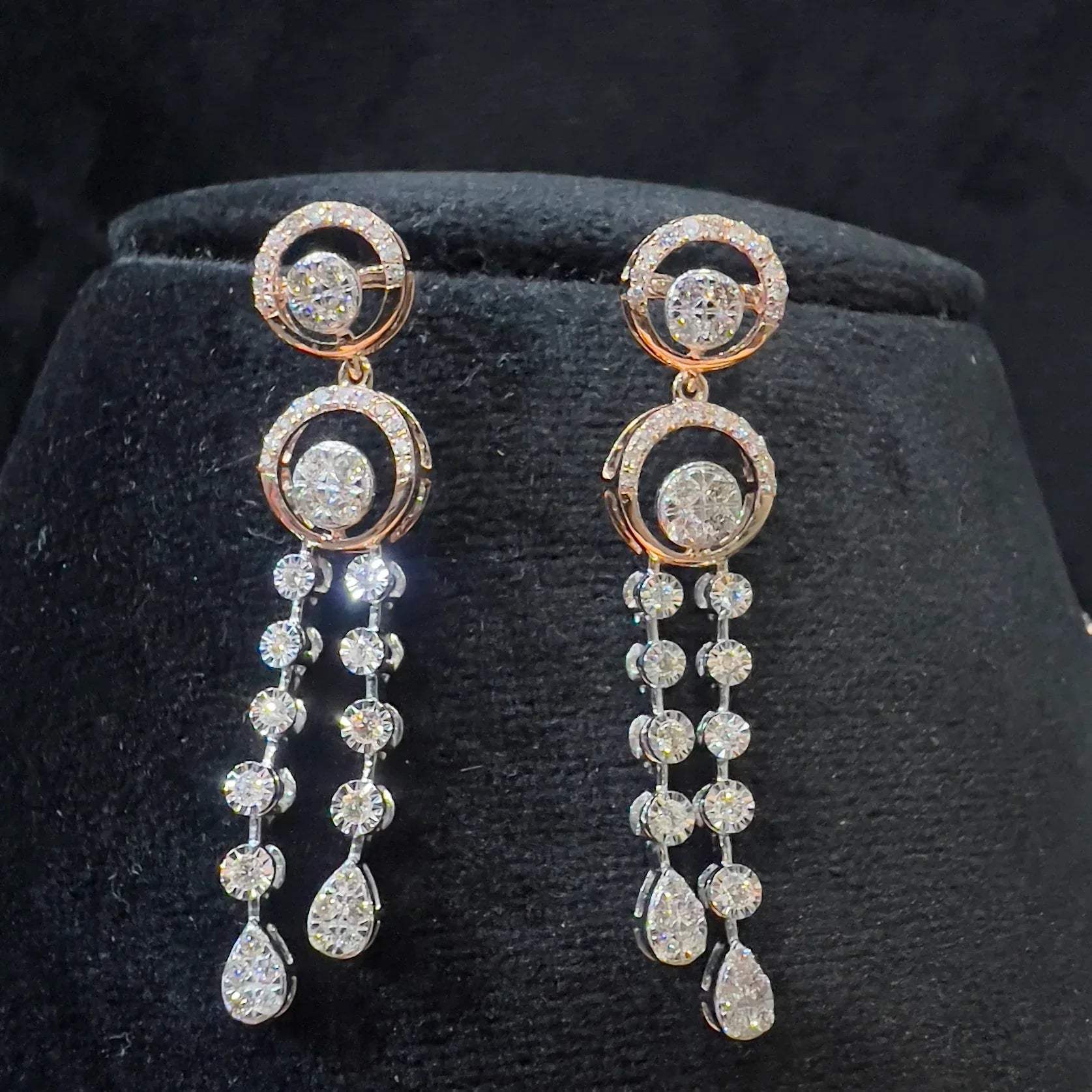 Diamond necklace set with circular motif design and matching drop earrings, featuring sparkling stones in elegant modern style.