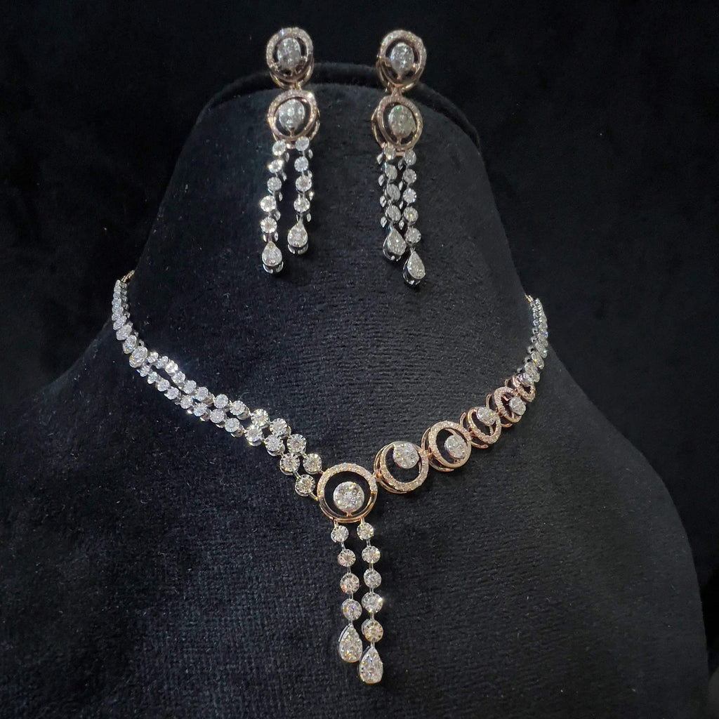 Diamond necklace set with circular motif design and matching drop earrings, featuring sparkling stones in elegant modern style.