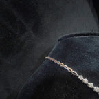 backside of diamond necklace set is showing on the mannequin.