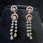 Diamond drop earrings with circular motif design, featuring sparkling stones in elegant modern style.