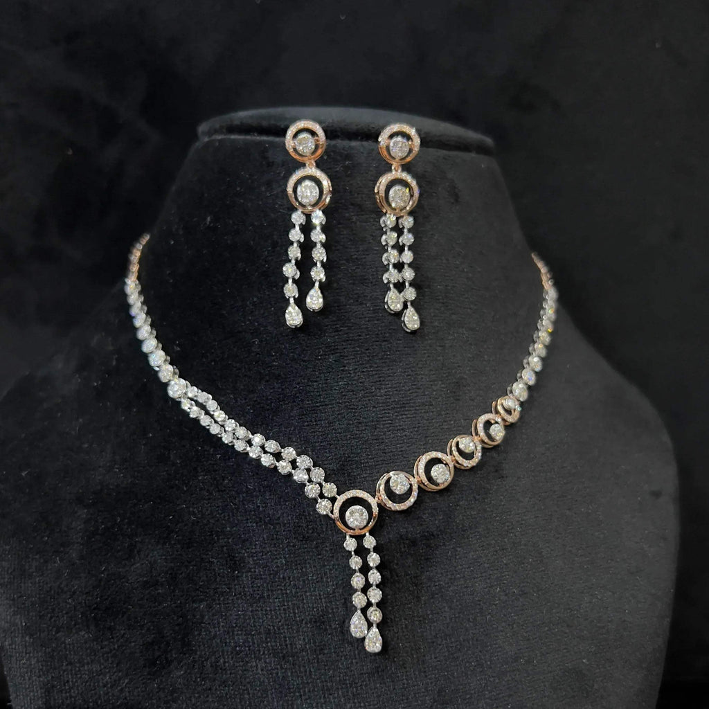 Diamond necklace set with circular motif design and matching drop earrings, featuring sparkling stones in elegant modern style.