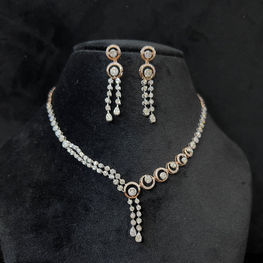Diamond necklace set with circular motif design and matching drop earrings, featuring sparkling stones in elegant modern style.