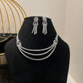 Eternal Knot Cascade diamond necklace set with matching earrings featuring layered diamond strands displayed on a mannequin.