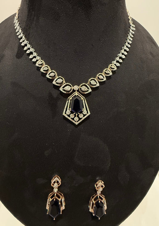 A gold diamond necklace with a geometric pendant and matching earrings displayed on a mannequin bust.