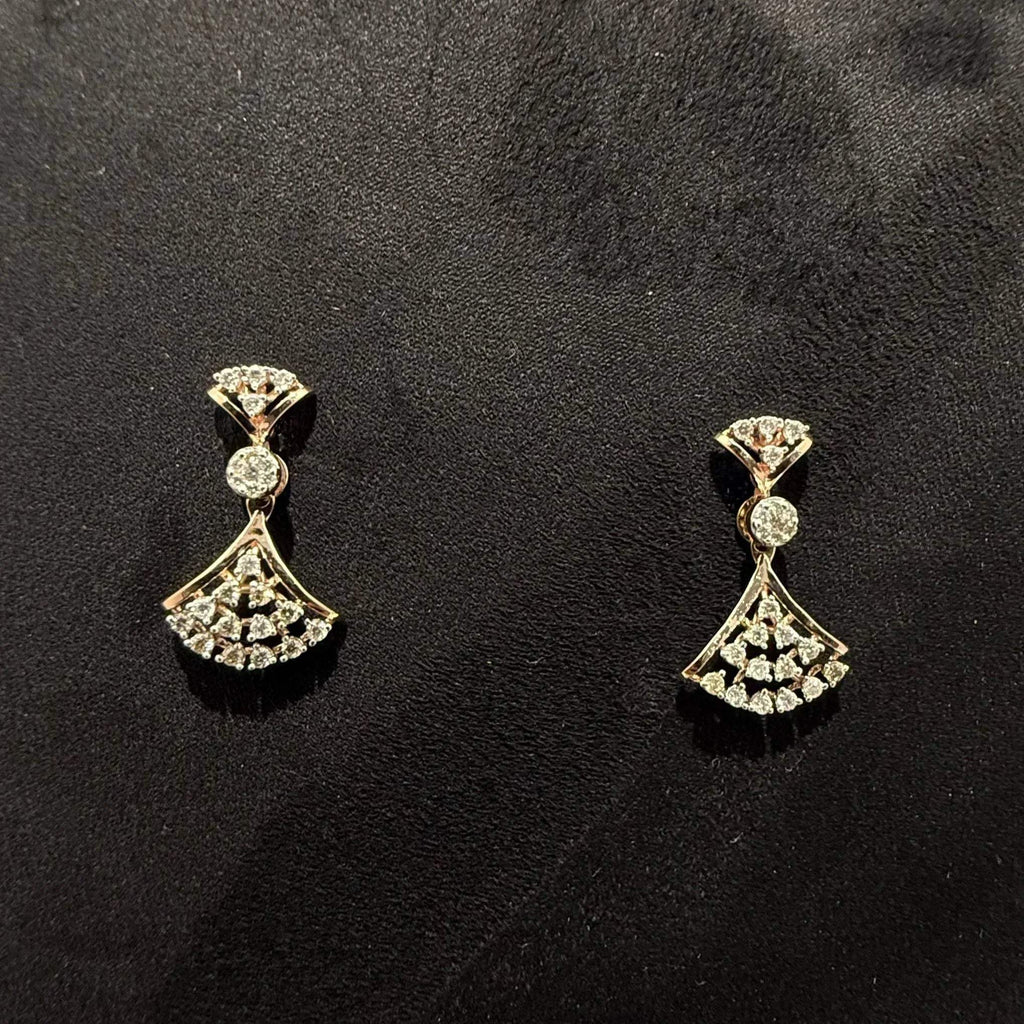 A luxurious gold diamond necklace with earrings set, displayed on a mannequin bust.