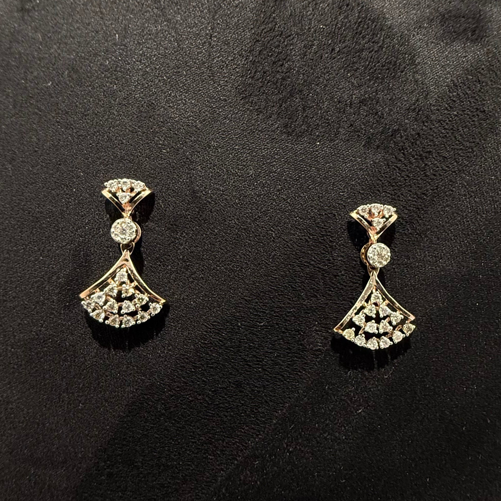 A luxurious gold diamond necklace with earrings set, displayed on a mannequin bust.