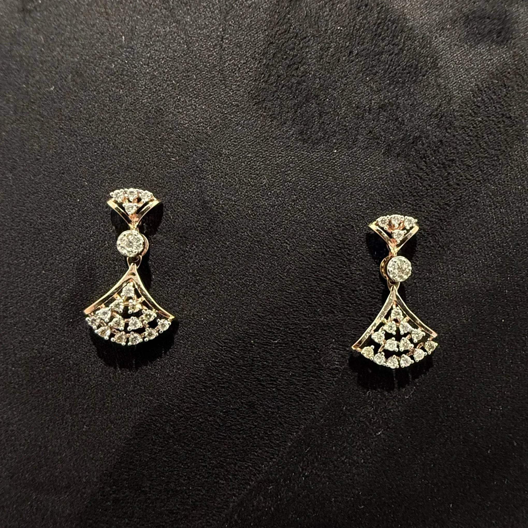 A luxurious gold diamond necklace with earrings set, displayed on a mannequin bust.